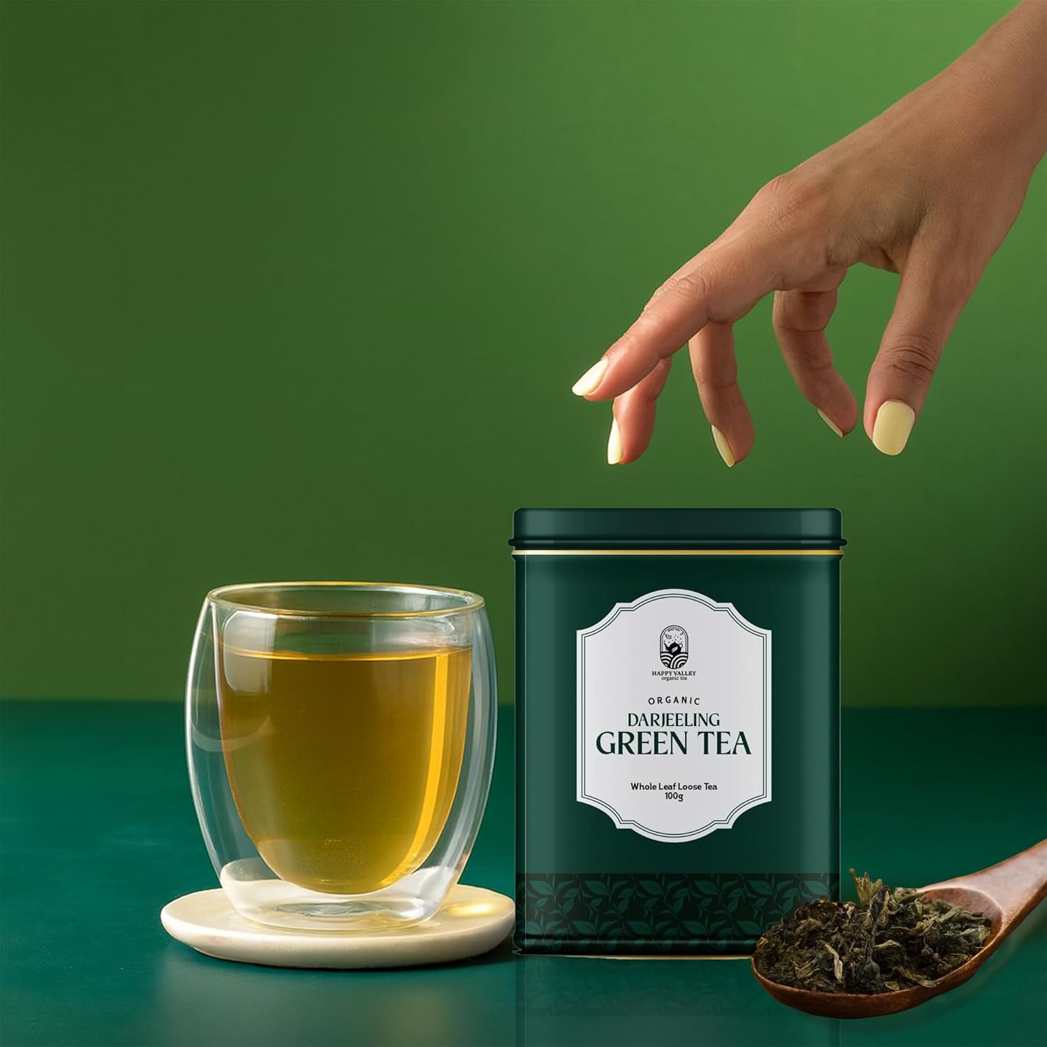 Green tea being brewed and served hot in cup lifestyle image