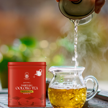 Organic Darjeeling oolong tea being poured into glass cup