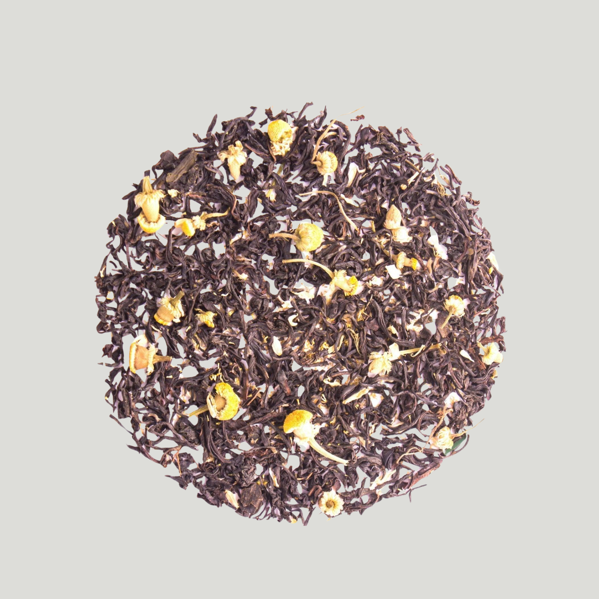 Loose leaf Darjeeling black tea blended with chamomile flowers.