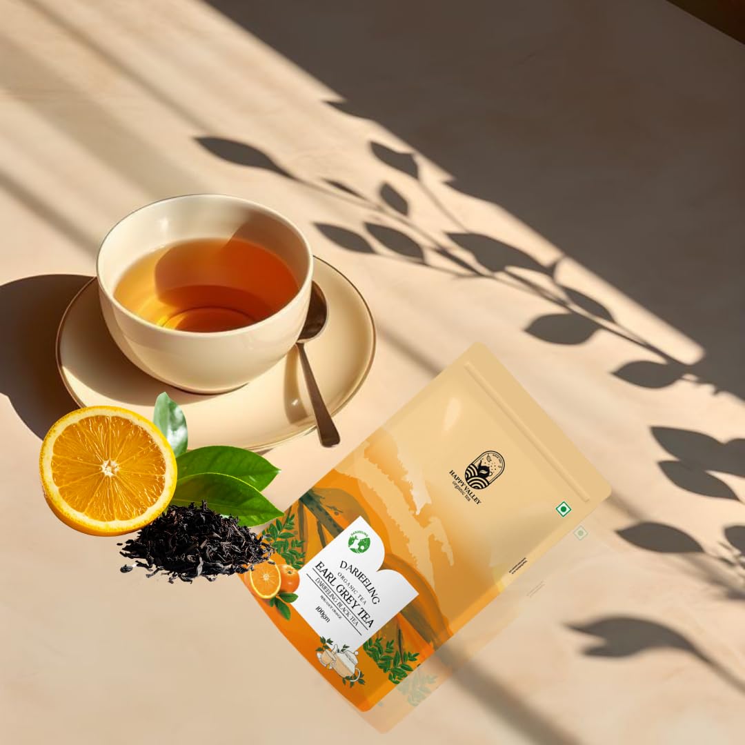Darjeeling Earl Grey orange tea presented with cup and citrus accents
